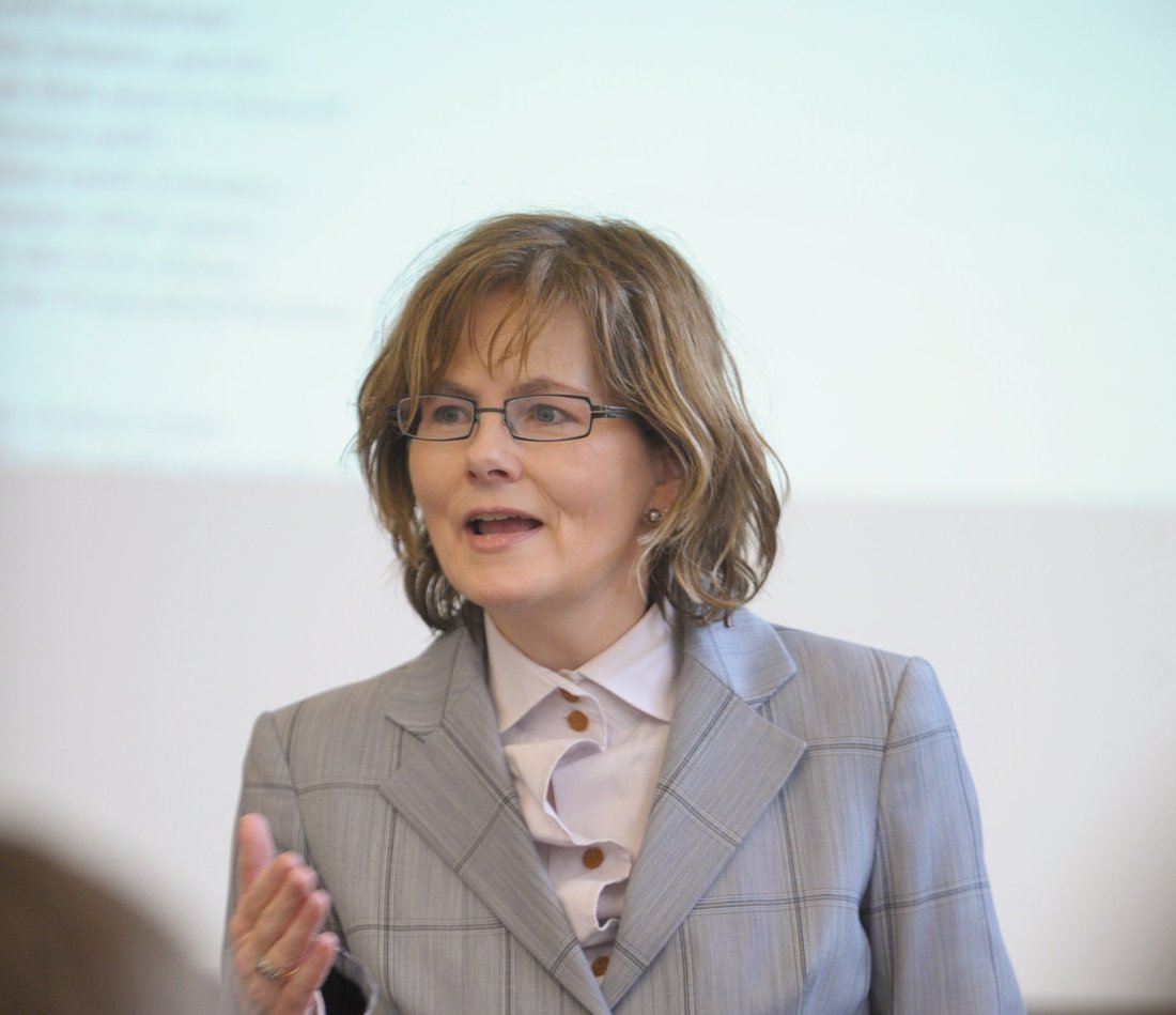 Dympna Callaghan teaching in a classroom.