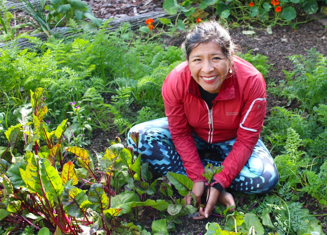 Mariaelena Huambachano in a garden.