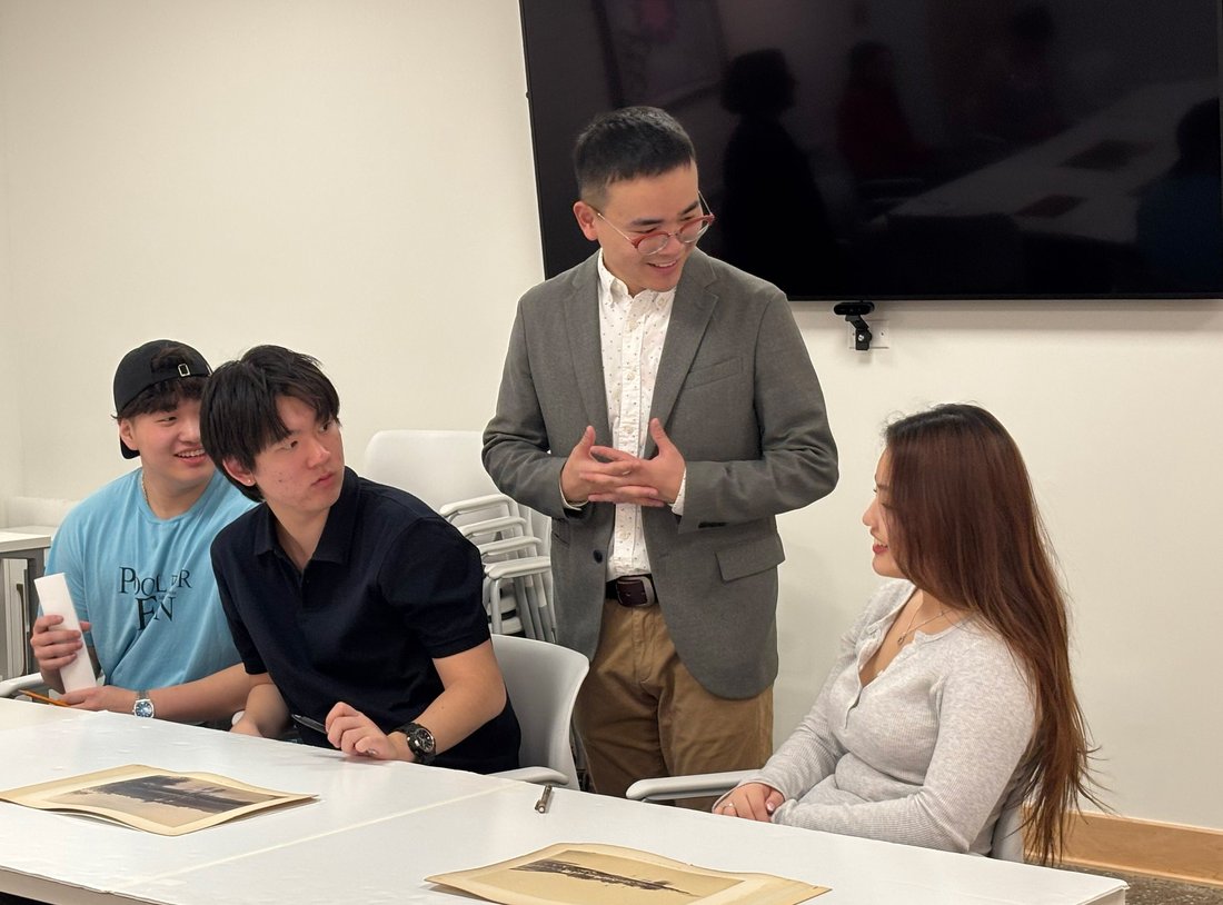 professor talking with three students