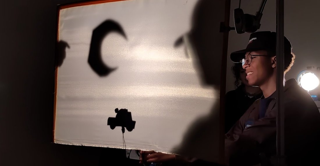 Teens with a Movie Camera participant creates shadow puppets
