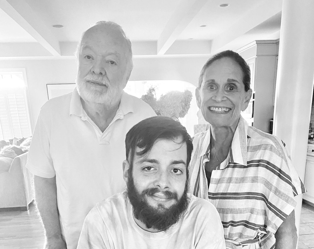 Black and white photo of three people.