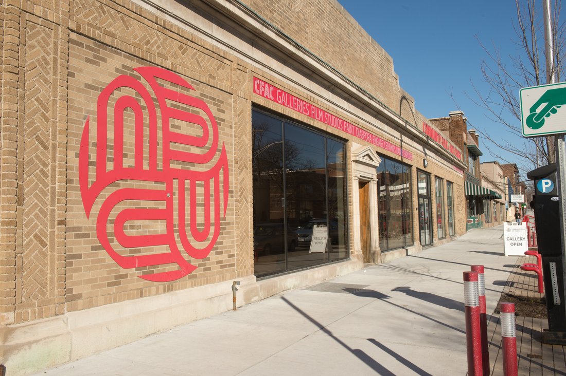 Exterior of building has folk art on it