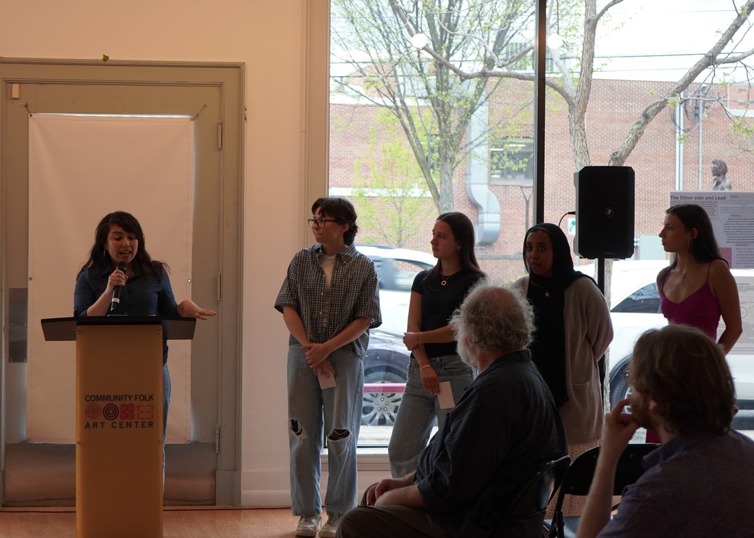 EHN Postdoctoral Fellow Miryam Nacimento presents with her students at EHN Showcase