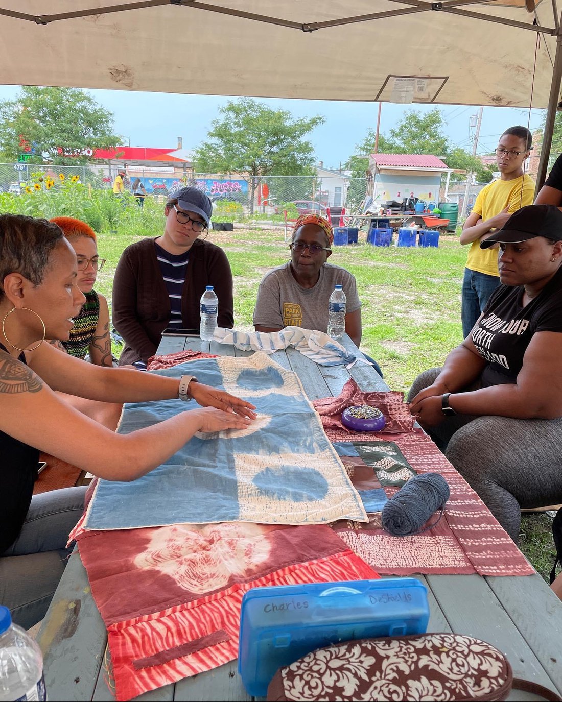 Group of people seated around a table.