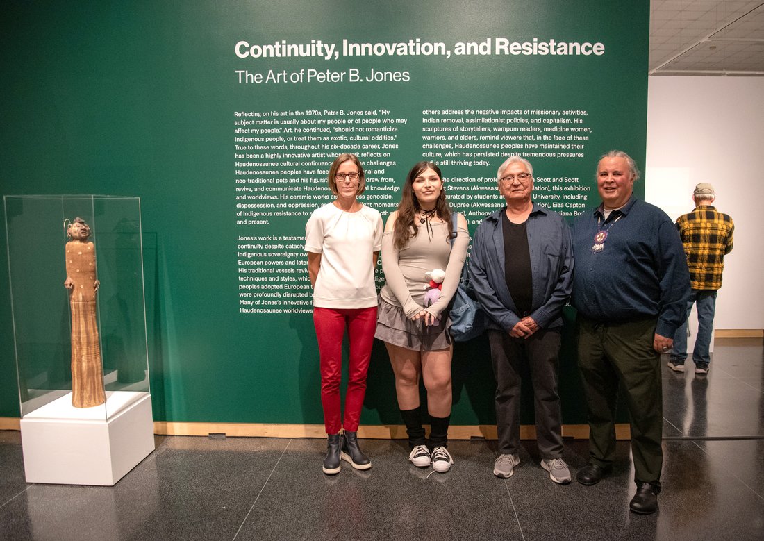 Sascha Scott (left) and Scott Manning Stevens (right) with student curator Eiza Capton (center, left) and artist Peter B. Jones (center, right) at the opening of Continuity, Innovation and Resistance.