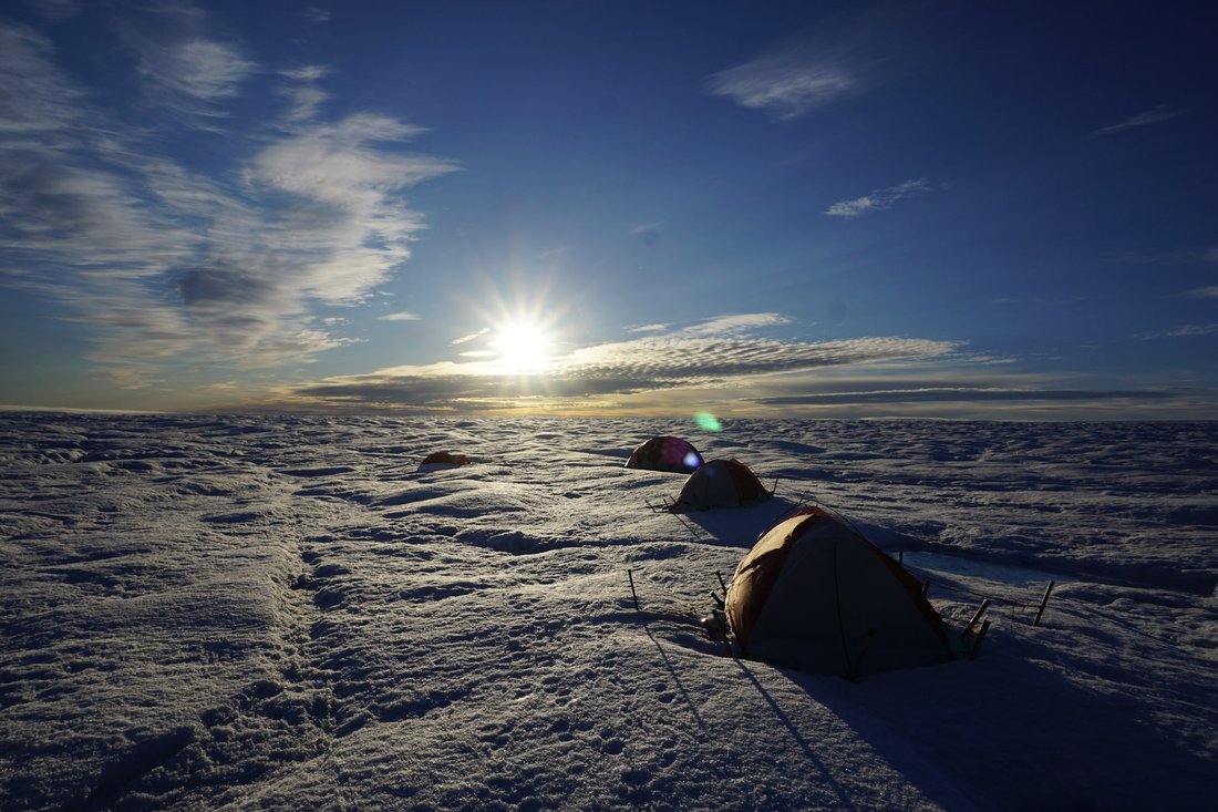 Base camps set up on an ice sheet.