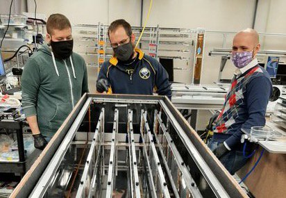 Graduate students performing checks on instrumented staves.
