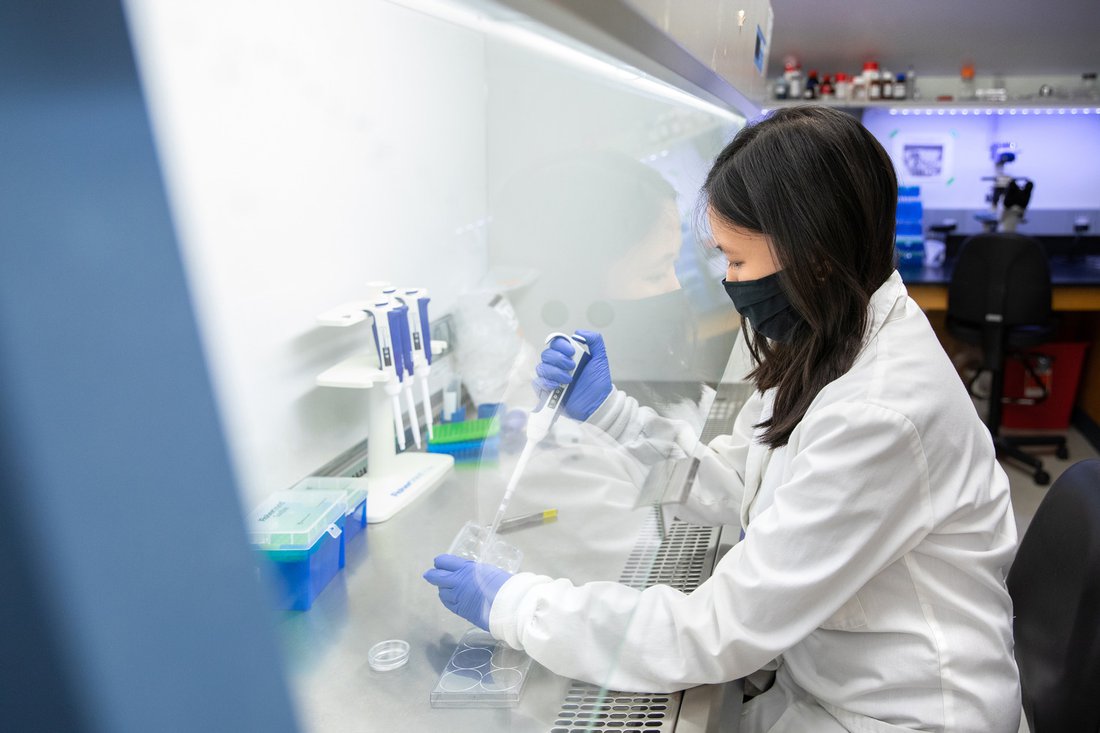 A student working with samples in a laboratory.