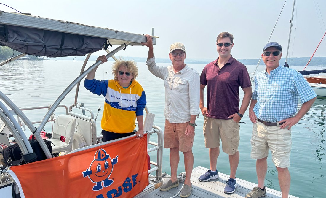 Three people on a boat.