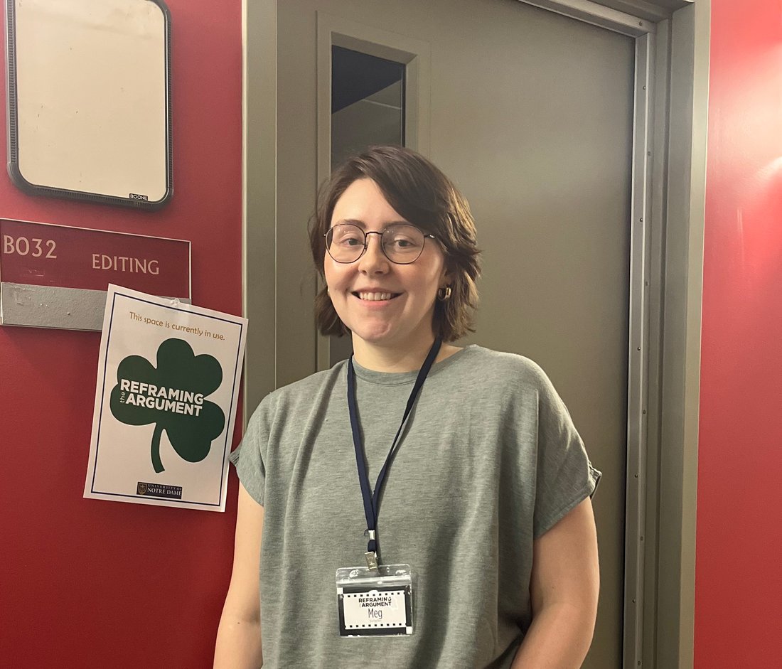 Person standing in a hallway.