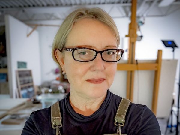 Portrait of a woman wearing glasses.