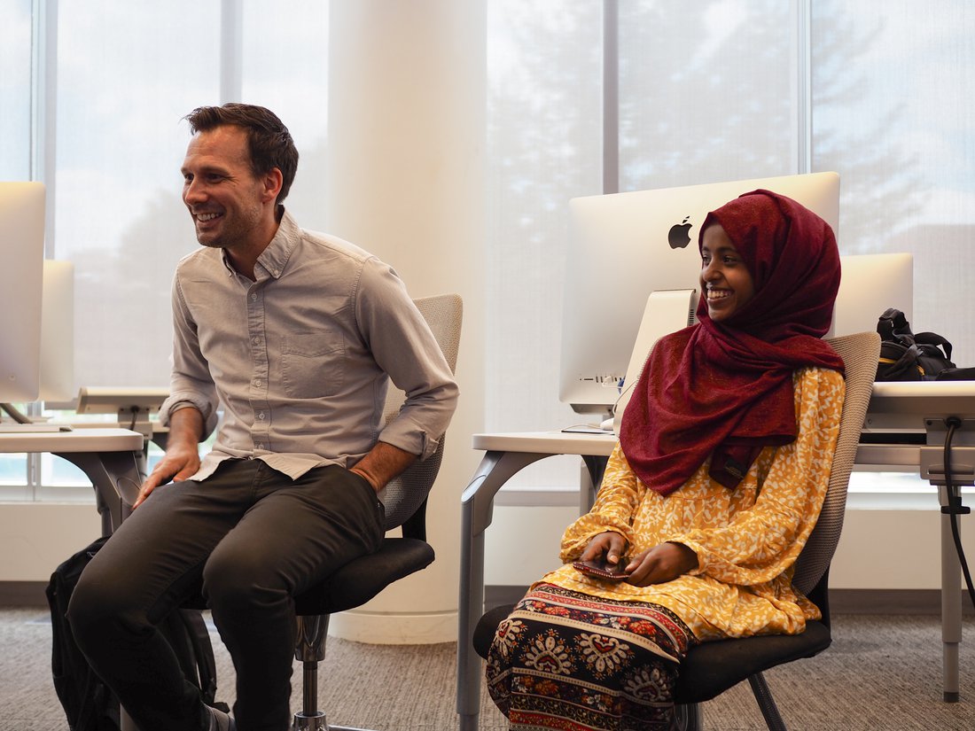 EHN Director and Narratio Fellowship Co-Director Brice Nordquist laughing alongside 2022 Narratio Fellow Hayat Mohammed