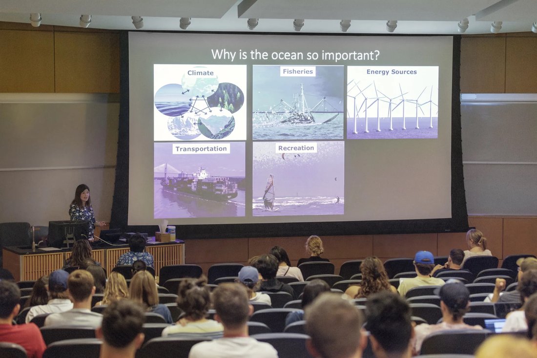 Class listening to a professor.