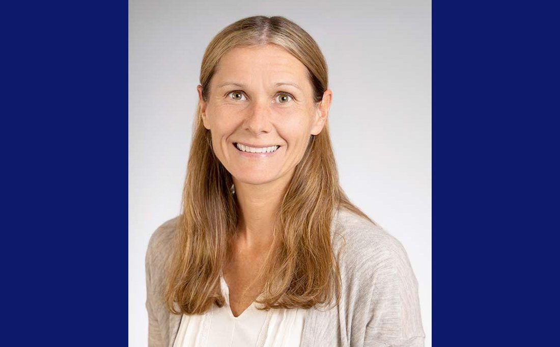 Rachel Razza Headshot with blue background