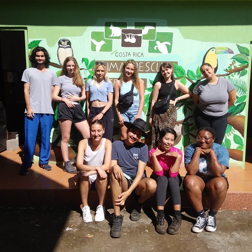 A group of interns in two rows at the Costa Rica Animal Rescue Center.