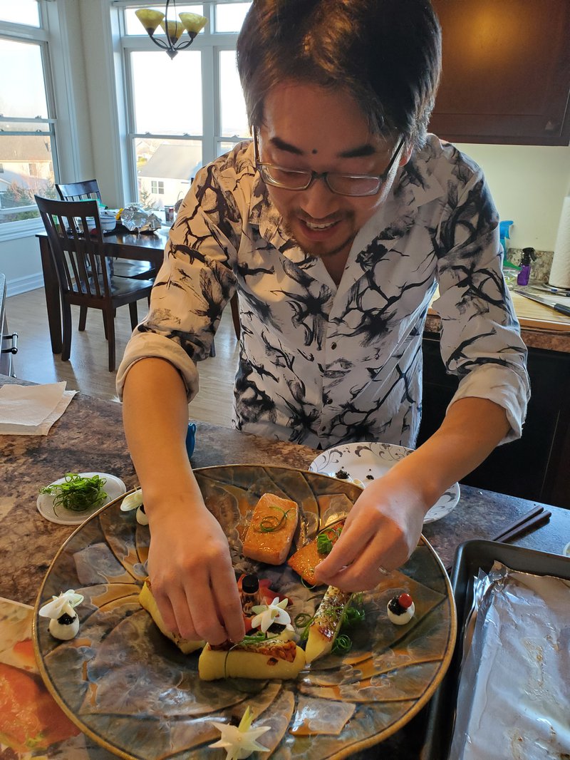 Zunli Lu prepares a seafood dish