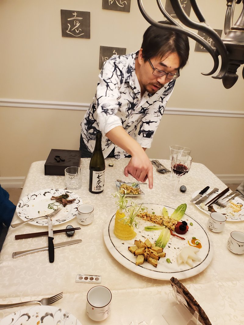 Zunli Lu explaining dragonfly dish