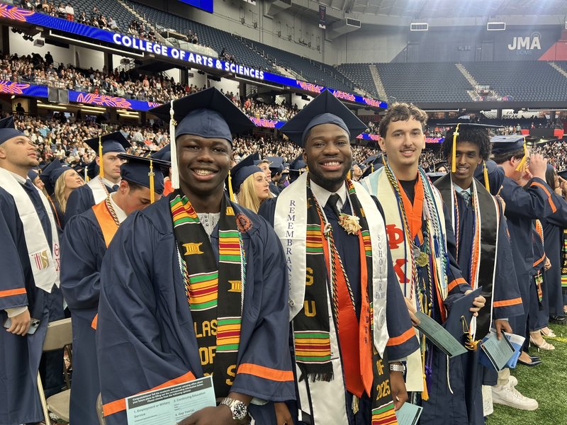 Smiling graduates.