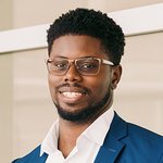 portrait of a person wearing glasses and a sport coat