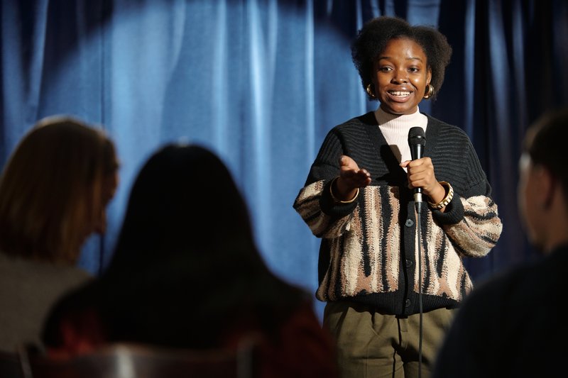 Female Comedian on stage.