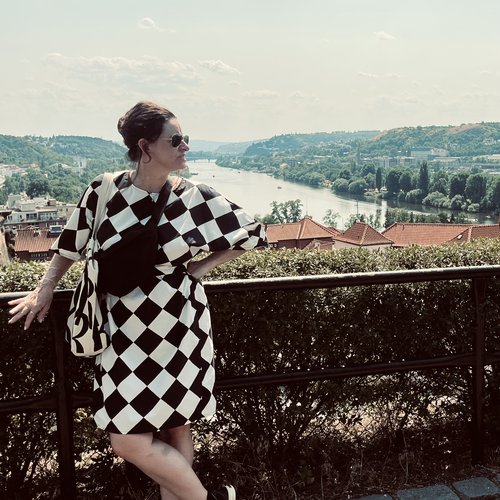 Woman standing on a bridge.