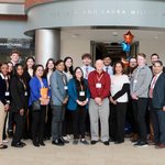 Group of people standing in the Jack and Laura Milton Atrium