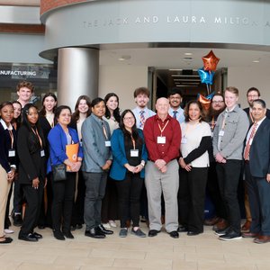 Group of people standing in the Jack and Laura Milton Atrium