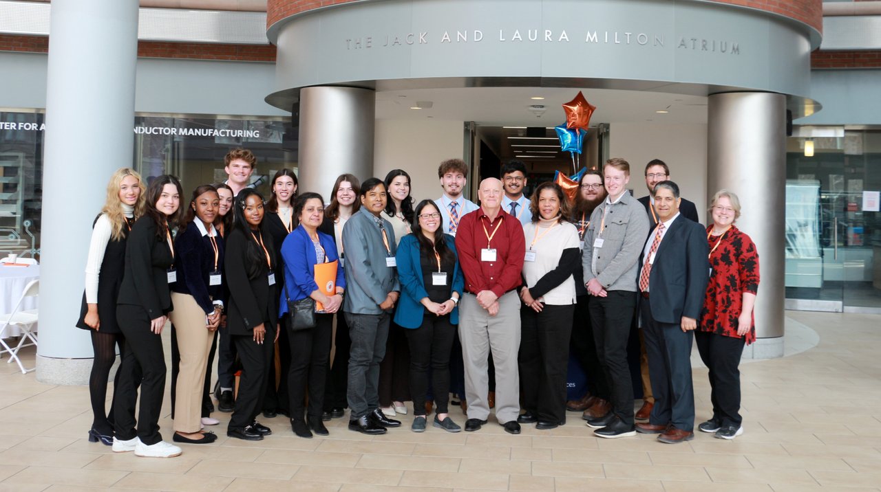 Group of people standing in the Jack and Laura Milton Atrium