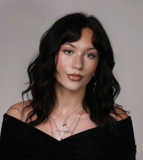 Portrait of a woman in a black shirt.