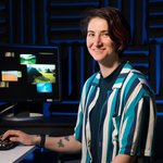 Chloe Britton Naime sitting at a computer in the lab.