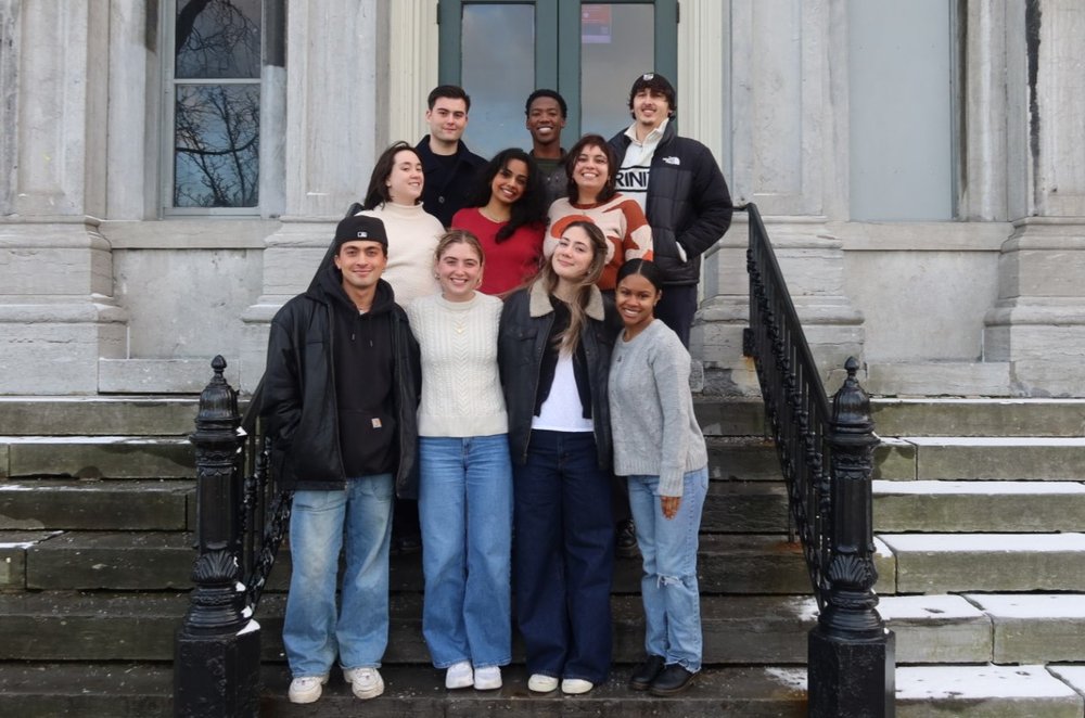 Group of students on the steps of a college building