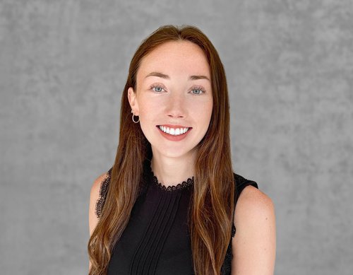 Headshot of a woman in a black shirt.