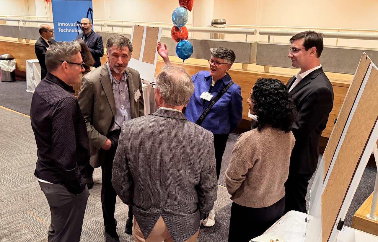 Group of people in a circle talking.