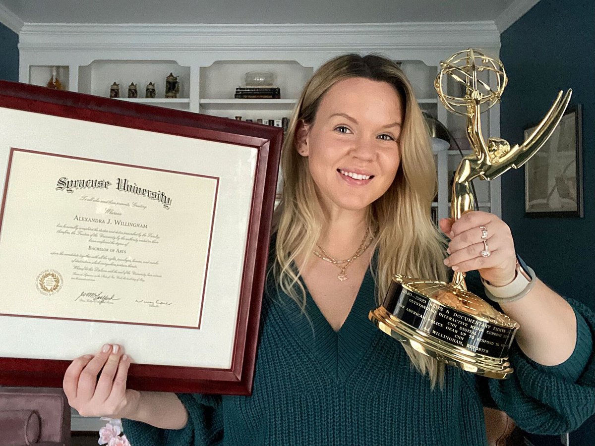 AJ Willingham holding a diploma and Emmy award.