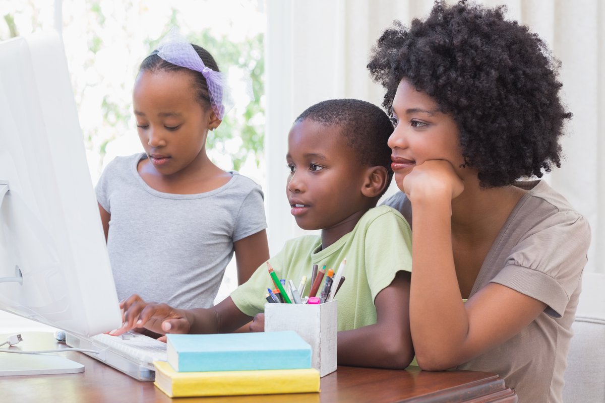 A family engages in remote learning.