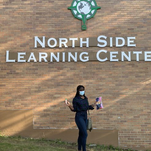 Favour Ononiwu standing outside the North Side Learning Center.