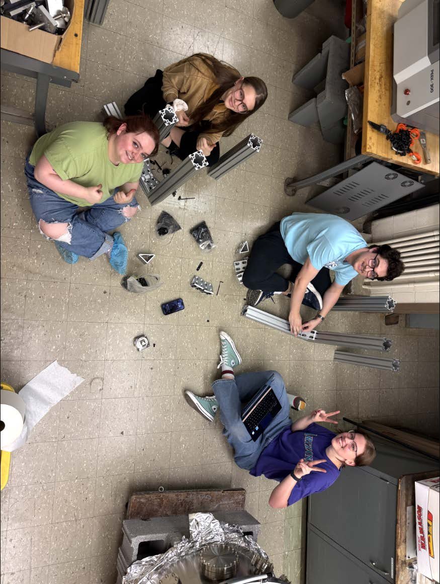 Physics students building a cart