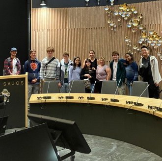 Group of students in a meeting room.