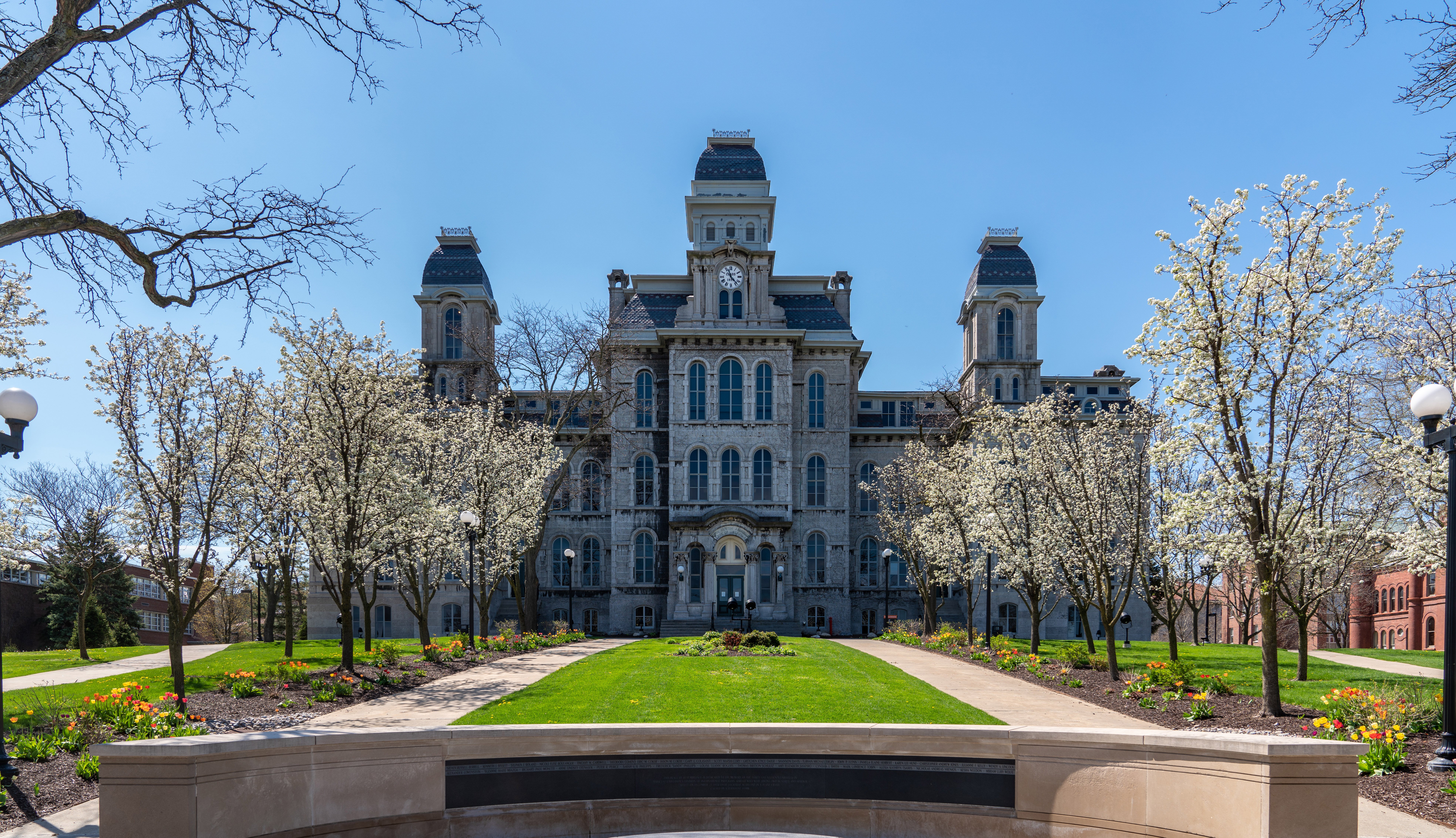 Hall of Languages building with spring flowers.