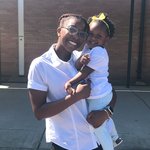 Woman holding a small child.
