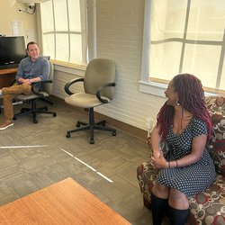 Tyler Sliker (left), clinic director at the Couple and Family Therapy Center, chats with Department of Marriage and Family Therapy graduate student Kalila Taylor in one of the therapy rooms at Peck Hall.