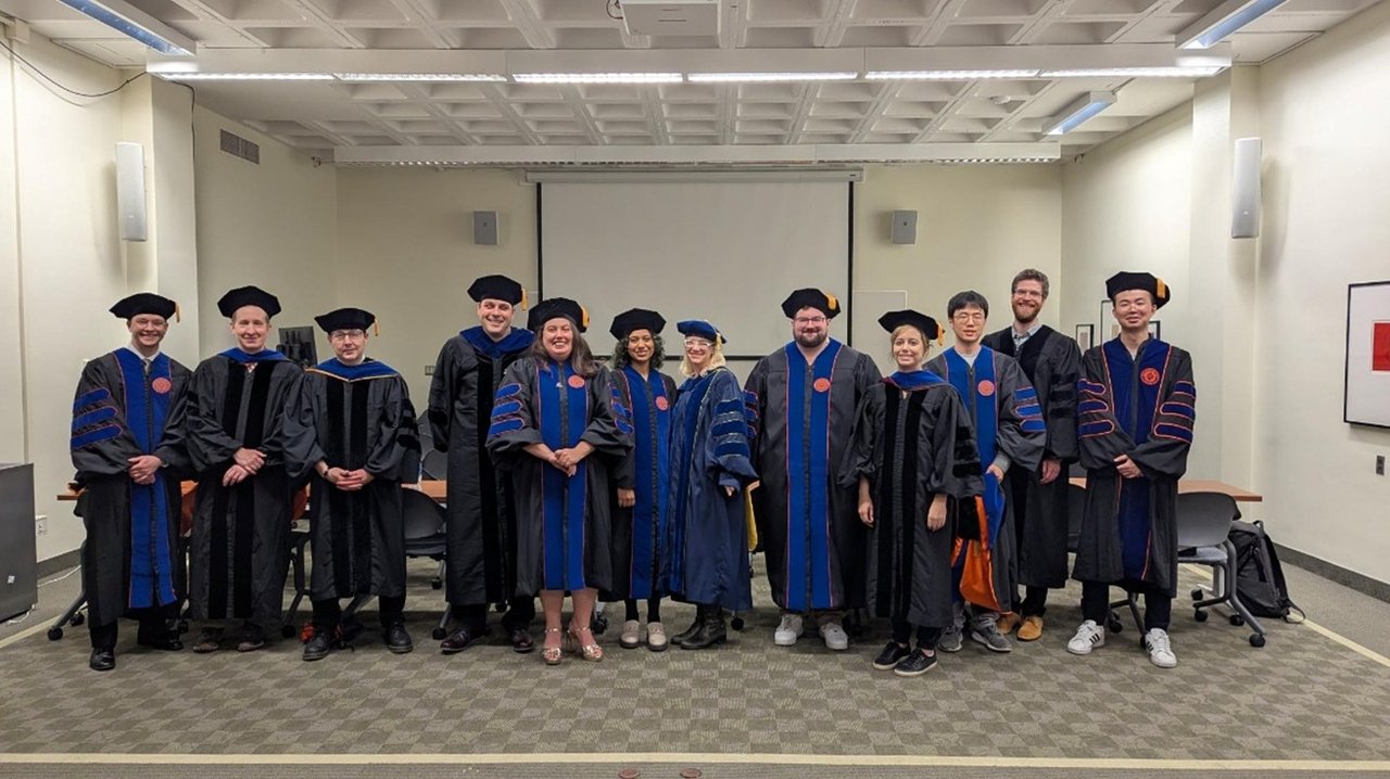 Group of people in cap and gowns.