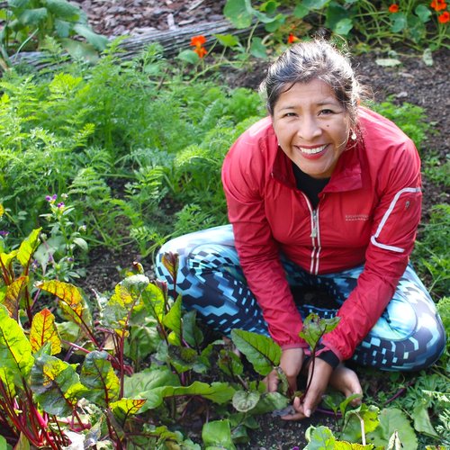 Mariaelena Huambachano in a garden.