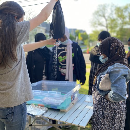 Group of people participating in a science project.