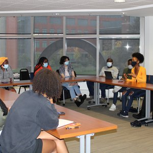 Group of people gathered at an Africa Initiative meeting.