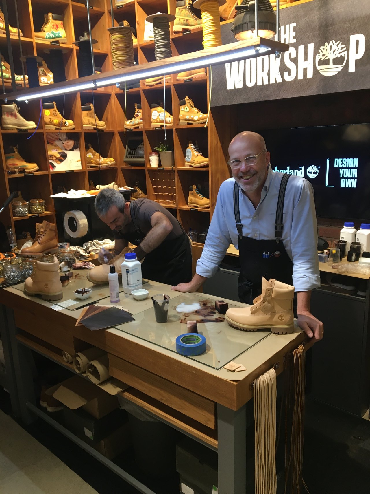 Two men in a shoe workshop.