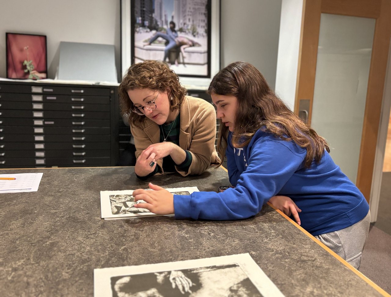 Two people viewing an art work.