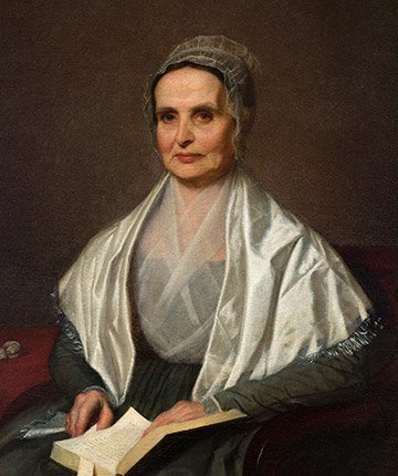 Portrait of Luctretia Mott holding an open book in her lap.