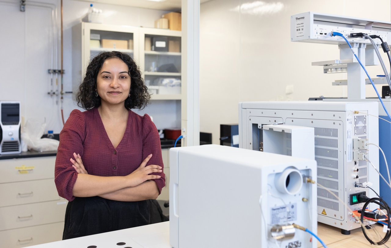 Woman standing in a lab.