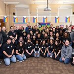 Trans Team members and community resource representatives and health providers gather in Peck Hall for Trans Support Day in March.